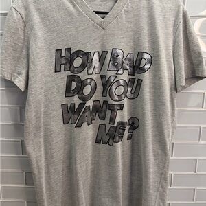 Title:
Dolce & Gabbana D&G Graphic V-Neck T-Shirt “How Bad Do You Want Me?”